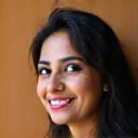 Photo of a smiling client, Fatima Khan.